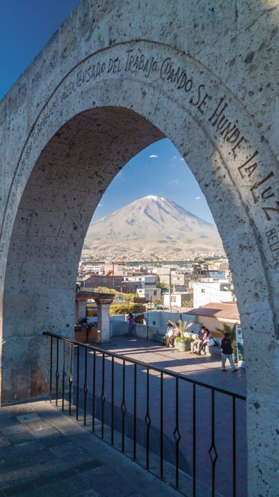 Arequipa's iconic archway with majestic Misti Volcano in the background.