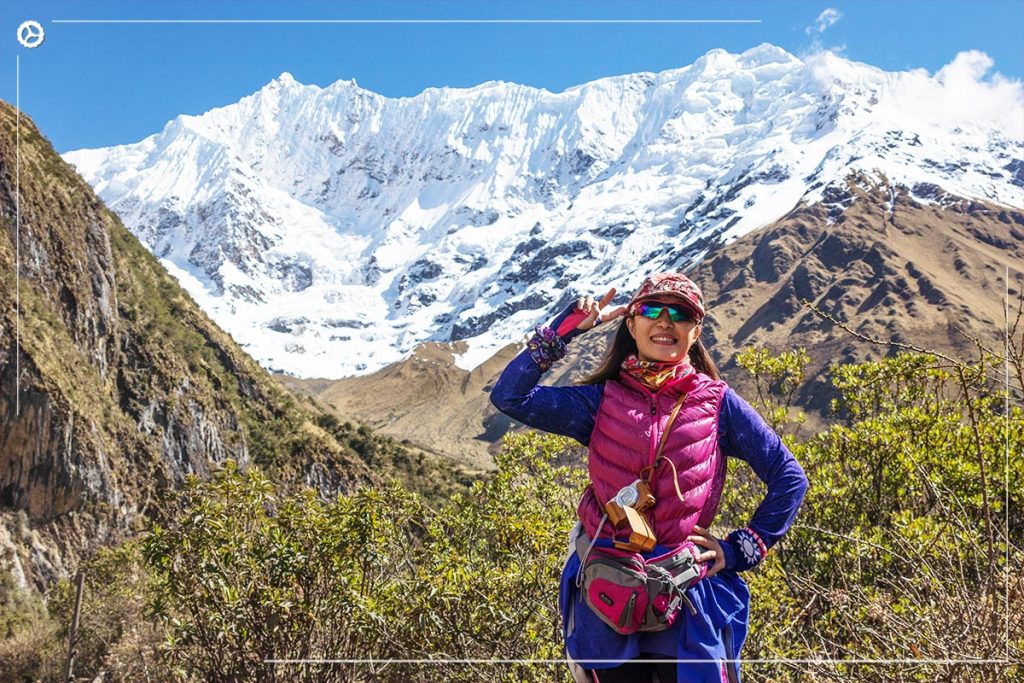 Hiker conquering the peaks of Salkantay