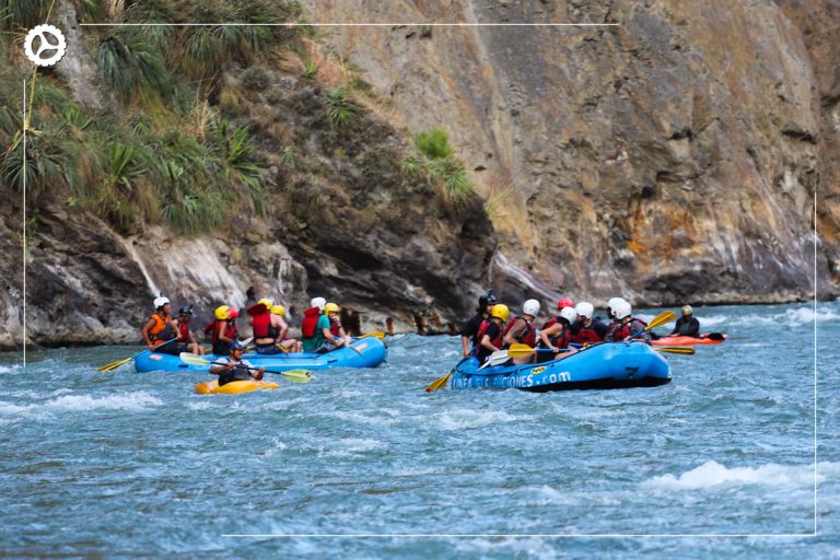 Groups of tourists braving the wild waters of Vilcanota
