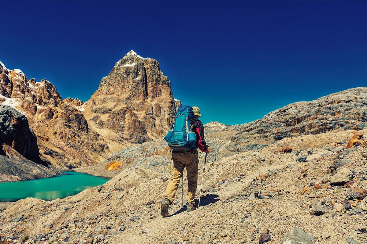 Solo backpacker traversing the rocky landscapes of the Andes