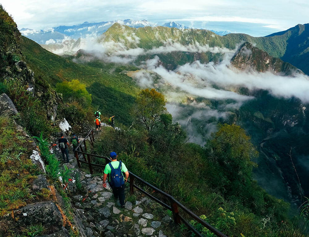 Hikers on the Inca Trail above cloud forest near Machu Picchu