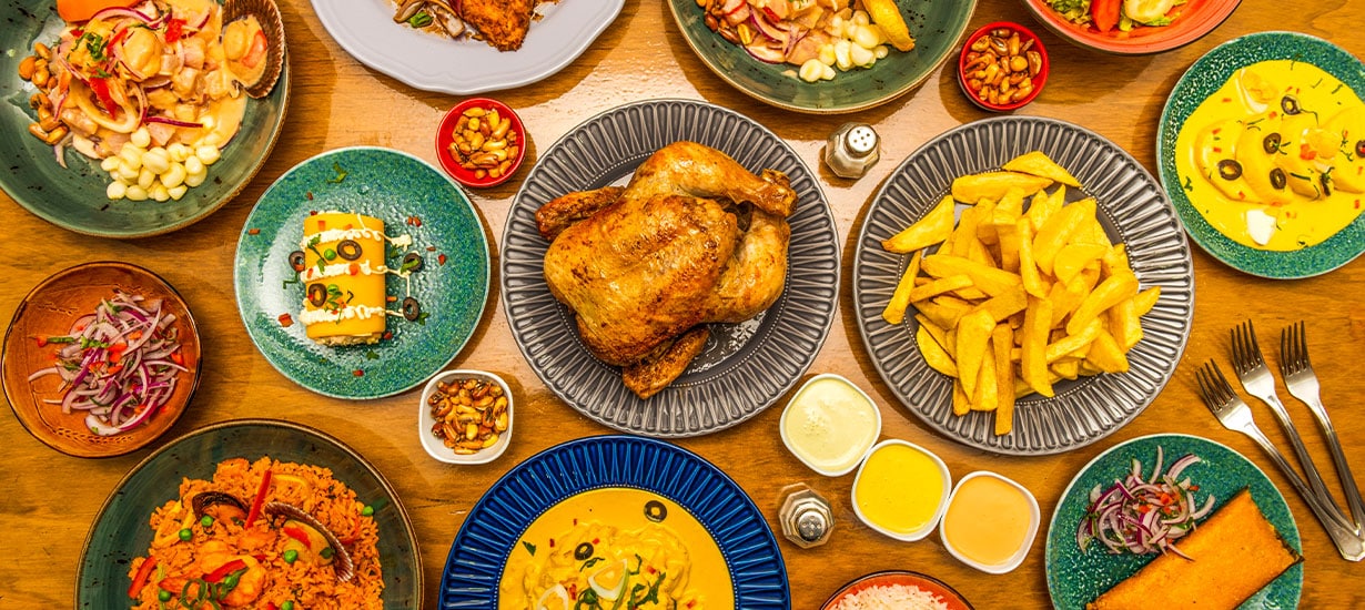 Peruvian Traditional Cuisine Comida Peruana Traditional Peruvian dishes served on a table.