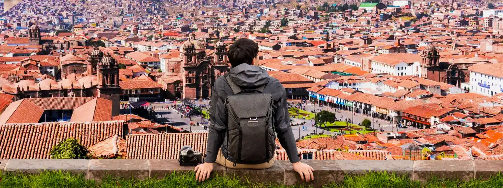 Traveler overlooking Cusco while planning how many days in Cusco do you need for a Peru trip