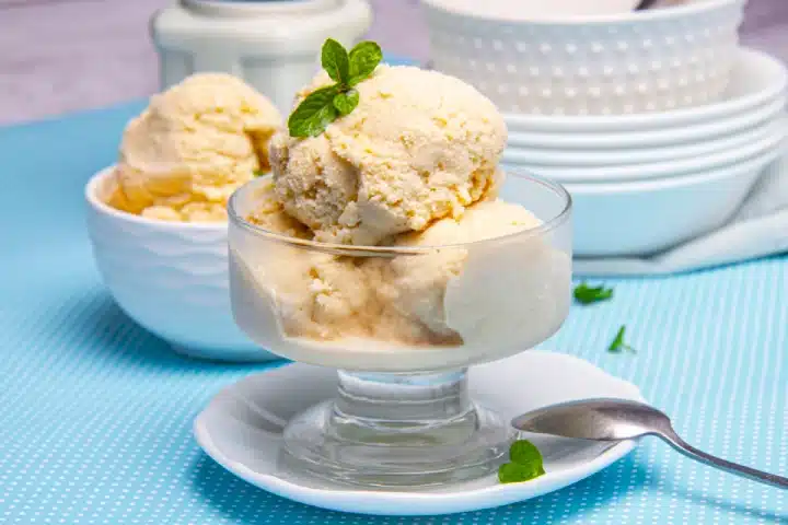 Postres Peruanos Tradicionales que debes probar 8 Queso helado from Arequipa served in a glass dessert cup.