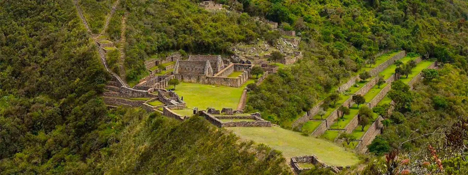 View of the agricultural terraces and archaeological structures at Choquequirao during the Choquequirao Trek in Peru.