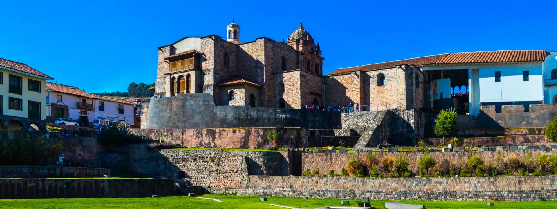 Panoramic view of Qorikancha Temple in Cusco, Peru, featuring Inca stone walls and colonial architecture.