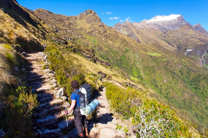 Classic Inca Trail vs Short Inca Trail: Which Trek Is Right for You? 5 Hikers ascending Dead Woman's Pass (Warmiwañusca) on the Classic Inca Trail