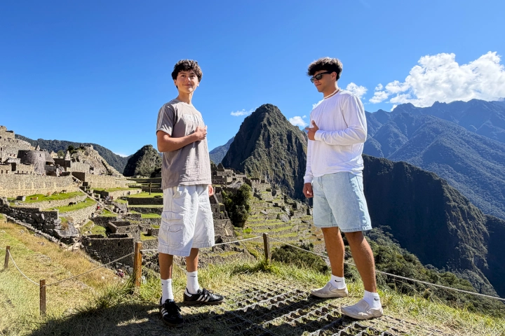 Classic Inca Trail vs Short Inca Trail: Which Trek Is Right for You? 8 Travelers enjoying the panoramic view of Machu Picchu after the Inca Trail