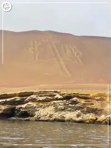 Paracas, Ballestas Islands, Huacachina & Nazca: The Perfect 2-Day Peru Itinerary 3 The Candelabra geoglyph seen from a boat near Paracas, Peru