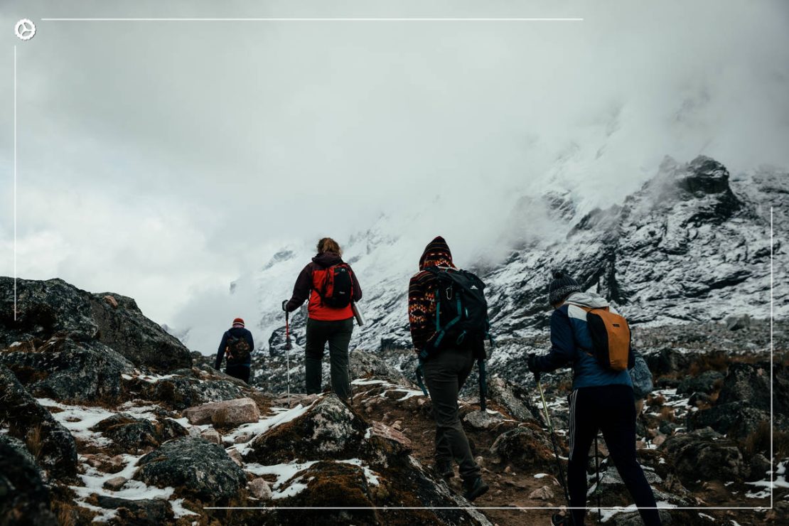 Hikers traversing the conditions of the Salkantay trek